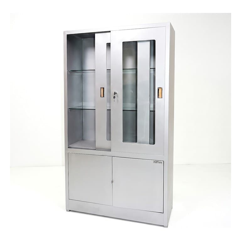 Instruments Cabinet, stainless steel, glazed sliding doors over glass shelves, lower double-door compartment, studio view