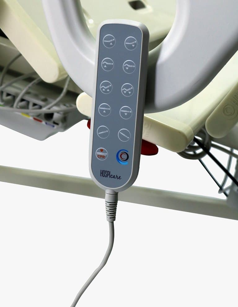 F5 Medical Bed, wired handset control hanging on the side rail, close-up