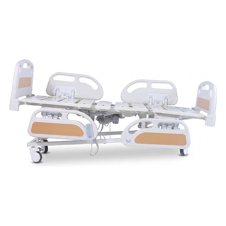 Multi-Functional PRIME care Bed, flat platform, split side rails with near pair lowered, side elevation studio view