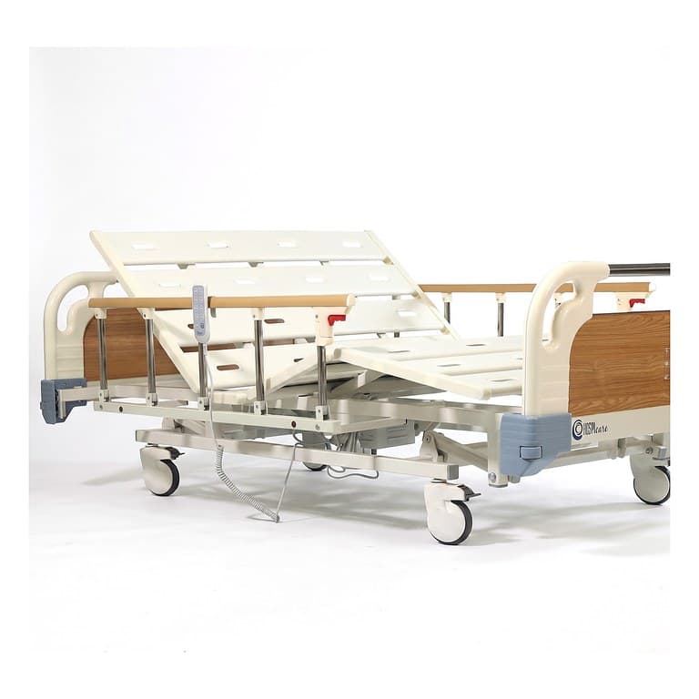 Three-Function Bariatric Bed (Wide), backrest and knee section raised, side rails up, handset on rail, foot-end view
