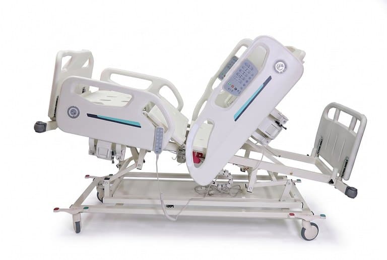 Santron Pro ICU Bed, backrest raised, side studio view with hanging handset control