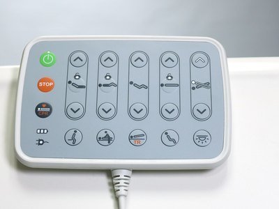 F5 Medical Bed, close-up of wired control pad with power, STOP, CPR and section position buttons