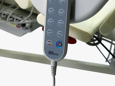 F5 Medical Bed, wired handset control hanging on the side rail, close-up