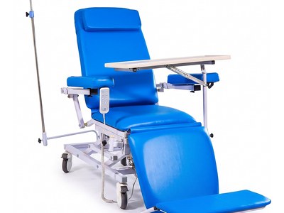 Four-Function Hemodialysis Chair, reclined with legrest raised, tray table across arms, IV pole, handset, studio view