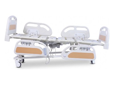 Multi-Functional PRIME care Bed, flat platform, split side rails with near pair lowered, side elevation studio view