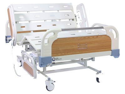 Three-Function Bariatric PRIME care Bed, backrest and knee rest raised, wood-grain panels, three-quarter studio view