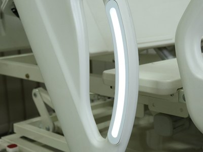 Santron Hospital Bed, close-up of the lit LED strip on the side-rail handle