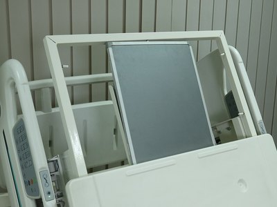 Santron Hospital Bed, rear close-up of the raised backrest with X-ray cassette holder